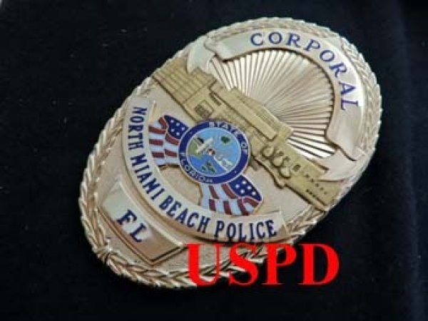 ノースマイアミビーチ市警察実物フラットバッジ コーポラル - USPD GEAR
